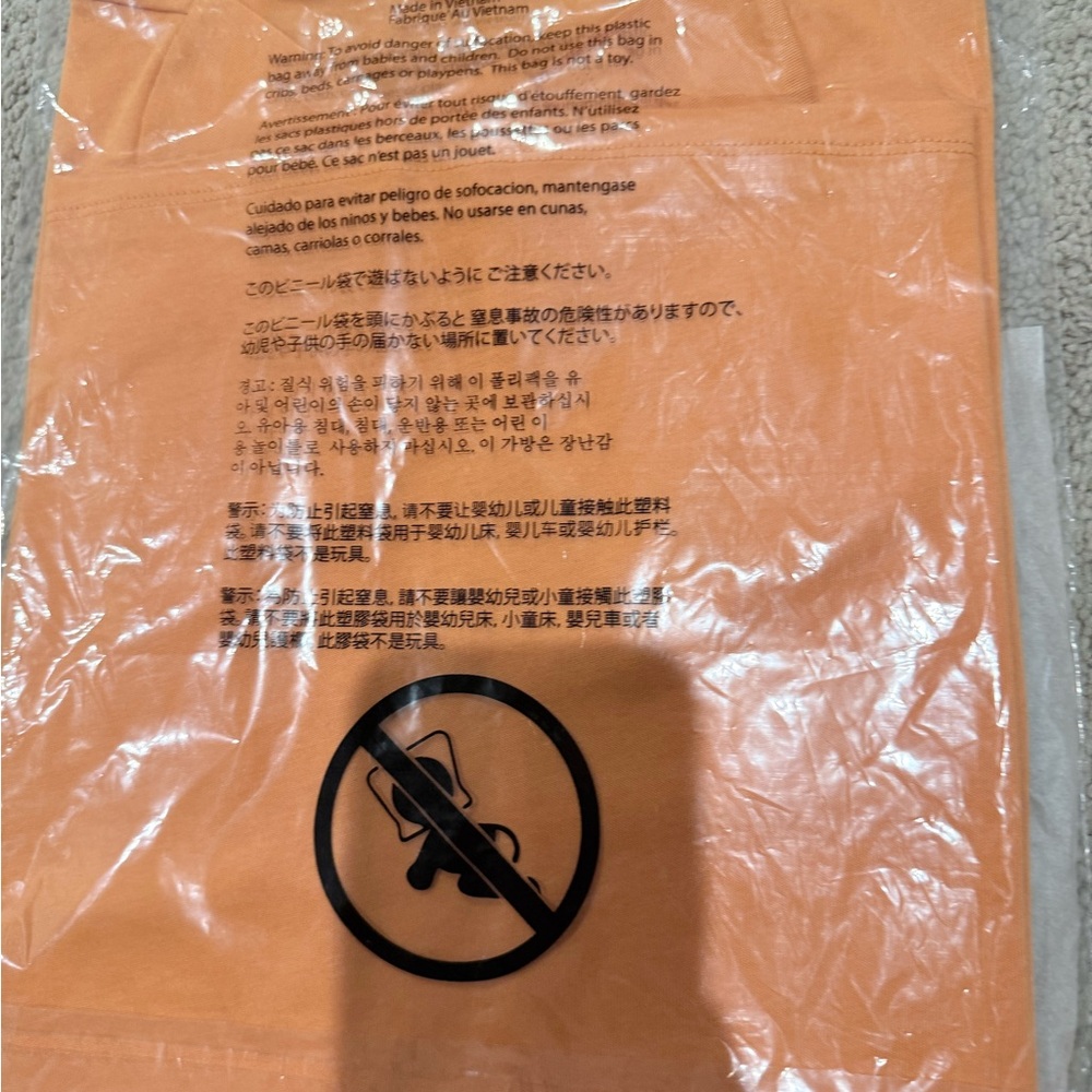 Michael Kors Orange Protective Sleeve with Printed Icons